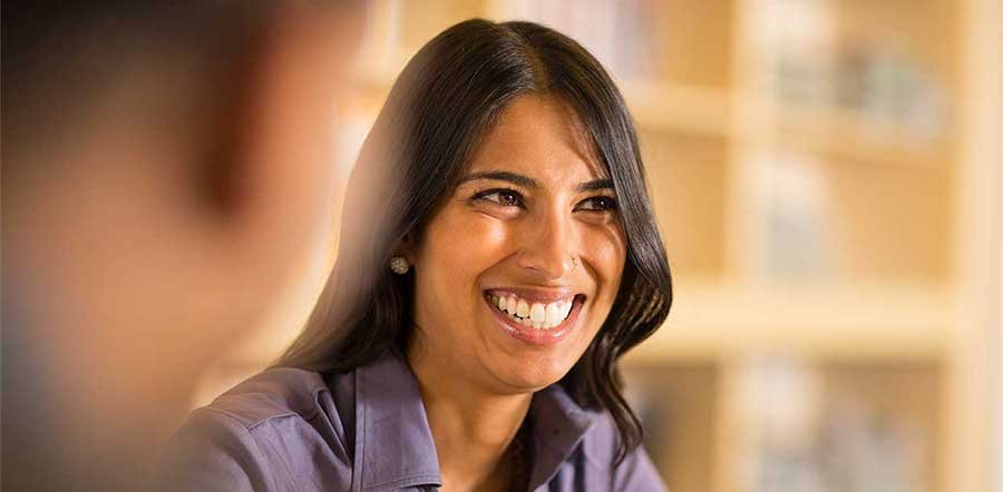woman smiling looking off camera